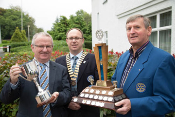 Kennr Fisher, President Roy and Ivan Kee with the cups