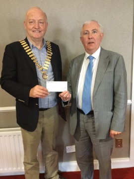 President Henry Robinson presents cheque