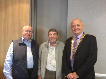 Past President Bob Baird and John Monaghan with President Henry