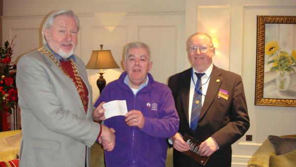 Colin presents a cheque